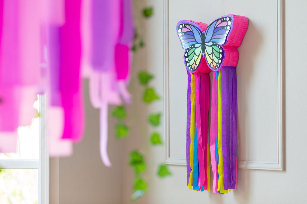 Riles & Bash Rainbow Butterfly Pinata with Colorful Streamers and Pink and Purple Streamer Backdrop_Butterfly Birthday_Rainbow Birthday